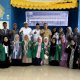 Mahasiswa UINSU peserta KKN dan aparatur Desa Silau Dunia foto bersama di sela kegiatan. (Foto: Dok/ Ist)